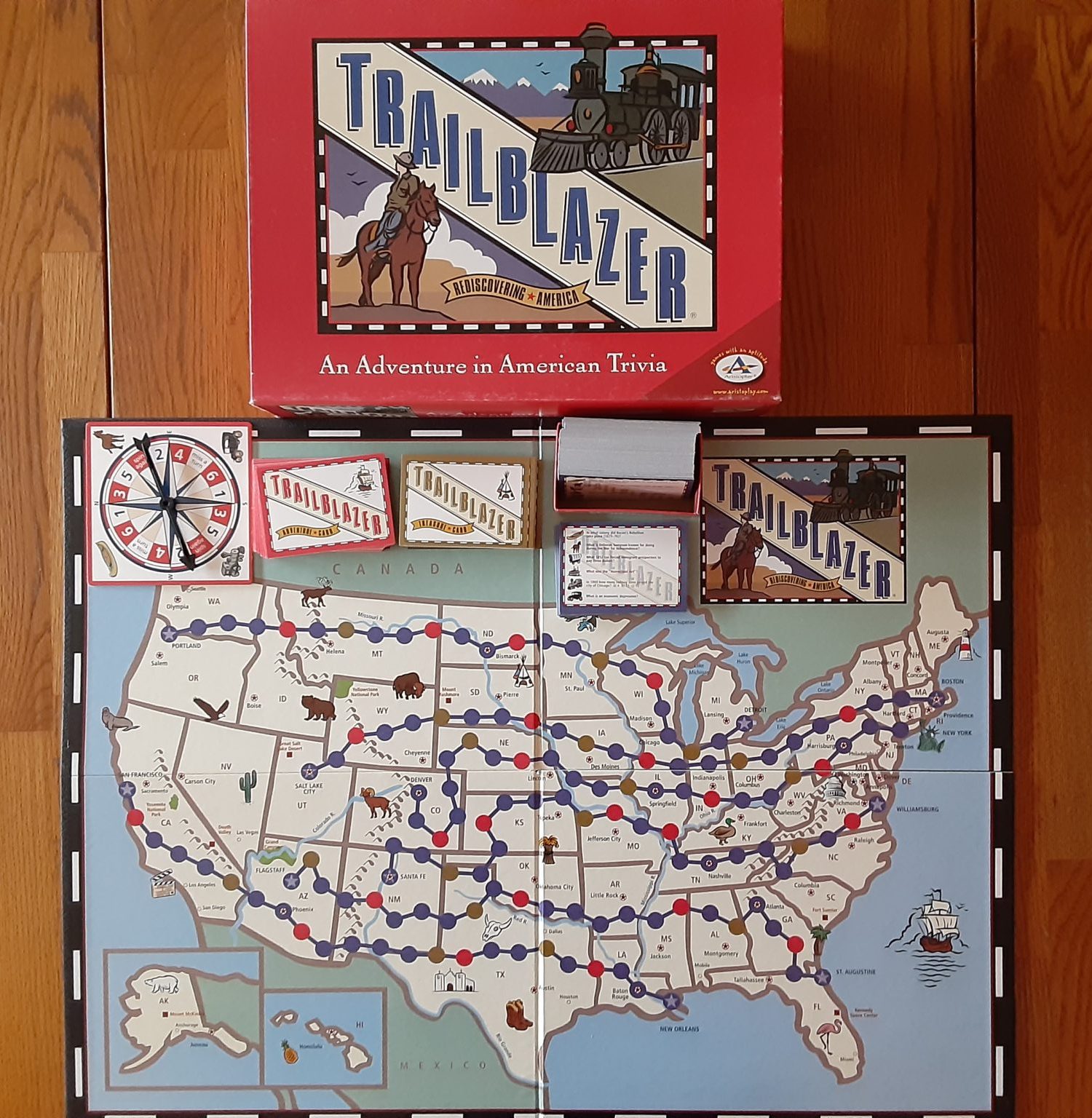 Picture of Trailblazer a history board game. Image of board, cards, spinner.