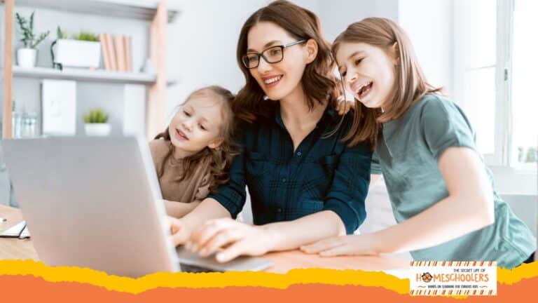 Mom looking at computer with kids